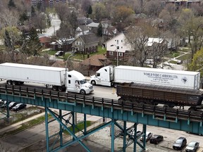 Trucks travel on the Ambassador Bridge in west Windsor on April 20, 2016.