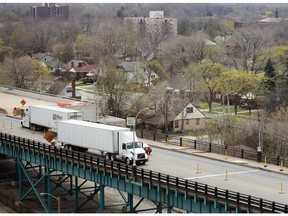 Trucks travel on the Ambassador Bridge in west Windsor on April 20, 2016.