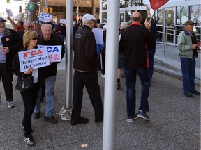 Unifor retirees protest in front of FCA Canada headquarters on Riverside Drive.