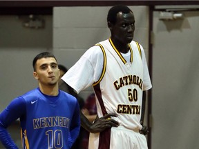 Jonathan Nicola, right, of the Catholic Central Comets catches his breath during a game against the Kennedy Clippers January 5, 2016.