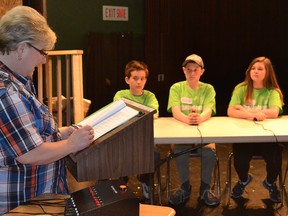 St. Antoine elementary school students Lucas Charbonneau, 11, from left, Maximus Poission, 12, Emma Iusan, 12, and Madison Marcoux, 11 listen to a question from host Annette Richard during a French-language trivia tournament held Friday, May 6, 2016, at E.J. Lajeunesse high school. Julie Kotsis/Windsor Star