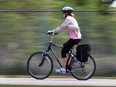 A cyclist rides along the Ganatchio trail in Windsor, ON. on Monday, May 30, 2016. (DAN JANISSE/The Windsor Star)