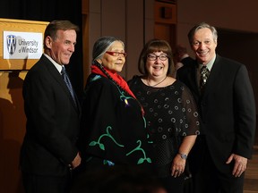 Honoured recipients Tony Doucette, left, Elder Mona Stonefish, Carol Reader and Thomas Porter gather for a group photograph during The 2016 Clark Award dinner at University of Windsor's Ambassador Auditorium Tuesday May 10, 2016. See story by Chris Thompson. (NICK BRANCACCIO/Windsor Star)