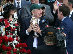Owner Paul Reddam and his wife Zillah celebrate in the winner's circle after Nyquist #13 won the 142nd running of the Kentucky Derby at Churchill Downs on May 07, 2016 in Louisville, Ky.