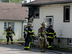 Windsor firefighters converge at the rear of 611 Benette Street after fire destroyed the rental unit May 25, 2016. Nobody was home at the time of the fire, but renters Alison Belliveau and Mark Godard lost most of their belongings in the fire.