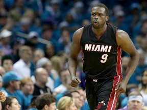 Luol Deng #9 of the Miami Heat reacts after a basket against the Charlotte Hornets during game six of the Eastern Conference Quarterfinals of the 2016 NBA Playoffs at Time Warner Cable Arena on April 29, 2016 in Charlotte, North Carolina.
