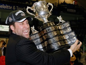 Windsor Spitfires general manager Warren Rychel is pictured with the Memorial Cup in this May 2009 file photo.