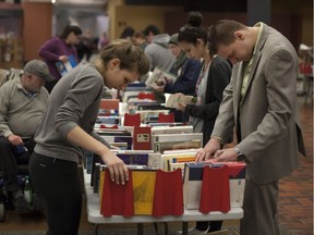 Book lovers browse through used books for sale at the Windsor Public Library Book Sale at the central branch in downtown Windsor, Saturday, May 14, 2016.