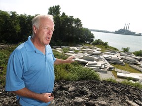 Francis Kennette, co-owner of land in Brighton Beach being used to store concrete and rubble from the parkway project, is pictured Monday, Aug. 25, 2014.