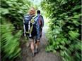 Couple hiking on trail. Photo by Getty Images.