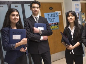 Massey high schooll students, from left, Julia Kafalghazal, 15, Jacob Abiad, 15 and Lucille Xiong, 16, were among almost 40 students to take part in the DECA competition at Vincent Massey Secondary School Saturday, May 14, 2016.