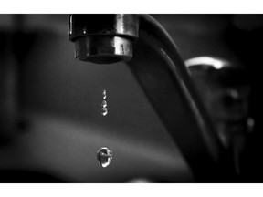 Tap dripping with water. Photo by Getty Images.