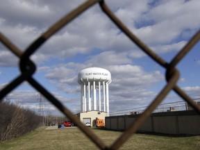 This March 21, 2016 file photo shows the Flint Water Plant water tower in Flint, Mich.