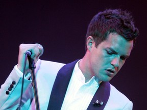 Brandon Flowers, lead singer of The Killers, performs on the Pyramid Stage on the first day of the Glastonbury Music Festival 2005 at Worthy Farm, Pilton on June 24, 2005 in Somerset, England.