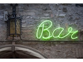 Green neon bar sign. Photo by Getty Images.