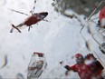 Leading Seaman Jeff Faucher, a crew member of the Canadian Coast Guard rescue boat Cape Dundas gets blasted by water during a rescue exercise in this May 2016 file photo.