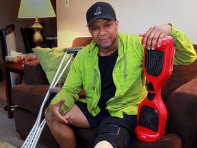 Windsor resident Les Holmes, his hoverboard, his crutches, and the knee brace he'll be wearing for the next three months.