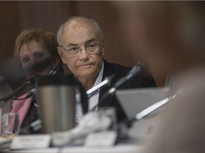 Martin Girash, board chair of the Erie St. Clair LHIN, listens as Philippa von Ziegenweidt, from the Citizens for an Accountable Megahospital Planning Process, speaks at the board of directors open board meeting at the Caboto Club on May 24, 2016.