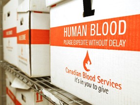 Canadian Blood Services boxes rest on a shelf in the Belleville General Hospital laboratory in Belleville, Ont. Thursday, July 2, 2015. A single donation of blood may save the lives of as many as three people.