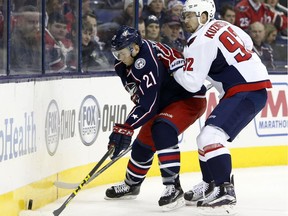 Columbus Blue Jackets' Kerby Rychel, left, tries to control the puck as Washington Capitals' Evgeny Kuznetsov defends during the second period of an NHL hockey game on Jan. 19, 2016 in Columbus, Ohio.