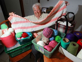 Tomka Minovski, 88, displays some of her impressive knitting and crochet work. She has knitted more than 500 baby caps that were donated for newborns in Guatemala May 22, 2016.
