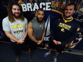 The University of Windsor Lancers Nate O'Halloran, Frank Renaud and Randy Beardy (left to right) are photographed in the team locker room in Windsor on Wednesday, May 11, 2016. The three teammates were selected in this years CFL draft.