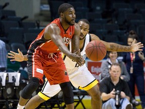 London Lightning guard Akeem Scott guards Windsor Express guard Tony Bennett during game 1 of their NBL Canada basketball playoff series at Budweiser Gardens in London, Ont. on Thursday May 12, 2016.