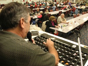 Mike Duval, owner of Paradise Bingo, calls out numbers for bingo in this file photo.