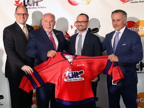 Windsor Mayor Drew Dilkens, left, OHL commissioner David Branch, Milos Vranesevic, MasterCard Canada, and John Savage, Windsor Spitfires governor, pose for a photo op at a media conference on Monday, May 2, 2016 at the WFCU Centre, after it was announced that Windsor will host the 2017 MasterCard Memorial Cup.