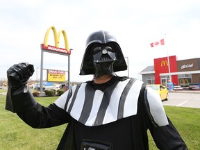 McHappy day volunteer Jeff Hillier, dressed as Darth Vader, greets customers at the McDonalds Restaurant on Ojibway Parkway in Windsor, Ont. on May 4, 2016.