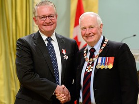 His Excellency the Right Honourable David Johnston, Governor General of Canada,  presents the Member of the Order of Canada insignia to John G. Kelton, C.M..  at the Order of Canada investiture ceremony at Rideau Hall, on Friday, May 13, 2016.