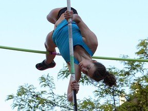 Pole vaulter Erica Fielder goes over the bar during the 2015 edition of Night Flight: A University of Windsor Athletics Club event that sets up a pole vaulting meet on Ouellette Avenue.