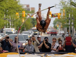 Robin Bone jumps during the Night Flight  pole vault event in Windsor on Friday, May 20, 2016. Pole vaulters took over the 300 block of Ouellette Avenue for the competition.