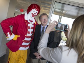 WINDSOR, ON.: MAY 6, 2016 -- Ronald McDonald, left, poses for a photo with Bob Renaud, chair of the board at Windsor Regional Hospital, at the unveiling of the Ronald McDonald House Windsor at Windsor Regional Hospital - Met Campus, Friday, May 6, 2016.  (DAX MELMER/The Windsor Star)
