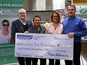 Bob Williams, Rob Campana, Nancy Campana and Reid Williams participate in a cheque presentation at Williams Restaurant Supply in Windsor on Tuesday, May 17, 2016. Williams donated $4403.10 bringing the 2106 total to $79045.44. The donation brings the total raised by the event to $269,442.14. Money raised at the event funds gay straight alliance and scholarships.