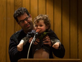 Tristan Fehrenback holds up his son, Jesper, 3, to say hello while Fehrenback spoke during a Greater Essex County District School Board meeting at the Board of Education, Tuesday, May 17, 2017.