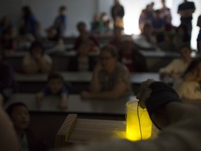 An LED light illuminates a jar full of liquid nitrogen during the Phunky Physics Show at the Science Rendezvous at the University of Windsor, Saturday, May 7, 2016.