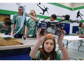 St. Patrick School student Natalie Fee with her lego mechanics robot on Friday April 29, 2016 in Peterborough, Ont. in preparation for the the 27th annual Ontario Technological Skills Competition: the largest skilled trades competition in Canada May 2 - 4 at RIM Park in Waterloo, Ont. The competition will attract over 2,100 elementary, secondary and post-secondary students from across Ontario, as they compete against the best skilled trades and technology students in the province. Clifford Skarstedt/Peterborough Examiner/Postmedia Network