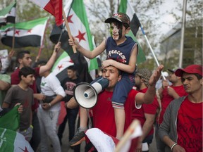 Local Syrians hold a rally outside City Hall, Saturday, May 7, 2016.  The rally was held to promote peace in Syria and show support for the people of Fort McMurray.