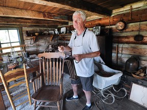 The Tecumseh Area Historical Society has renovated the museum in the town and has added a number of new items. Doug Drouillard, president of the association, is shown in the in the Lesperance family log cabin on Wednesday, May 25, 2016.