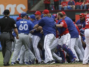 The Toronto Blue Jays and Texas Rangers have a benches clearing brawl during the eighth inning of a baseball game in Arlington, Texas, Sunday, May 15, 2016.