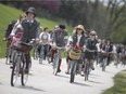 Participants in the 2016 Windsor Tweed Ride make their way along the Windsor riverfront dressed in old stylish attire, Saturday, May 7, 2016.