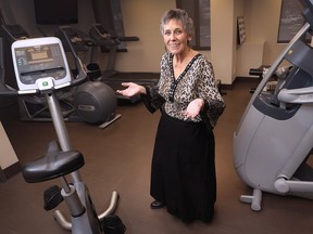 Pat Spindler has lost 195 pounds with the Weight Watchers program. She's shown in the fitness room at her Windsor residence.