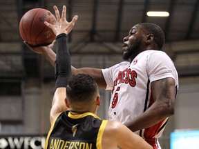 Tony Bennett of the Windsor Express drives past London Lightning's Ryan Anderson at the WFCU Centre on March 3, 2016.