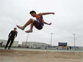 Evan John competes in the long jump during the WECSSAA Track and Field meet at Alumni Field at the University of Windsor in Windsor on Wednesday, May 11, 2016.