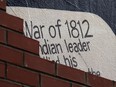 The remains of a mural are seen behind a new brick wall in Sandwich in Windsor on Wednesday, May 11, 2016.