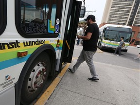 Passengers board a Transit Windsor bus at the downtown terminal on Thursday, May 12, 2016.