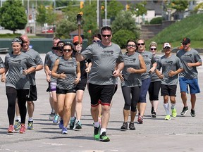The Torch Run for Special Olympics makes its way along the riverfront trail in Windsor on Wednesday, May 25, 2016. The torch run made several stops in the county before arriving in the city. The annual run raises funds for the Special Olympics.