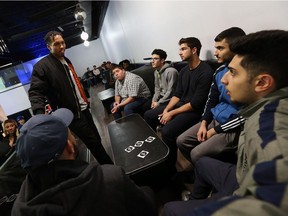 Windsor's Arjen Colquhoun (left) speaks to youth at Pushers in Windsor on Wednesday, May 4, 2016.