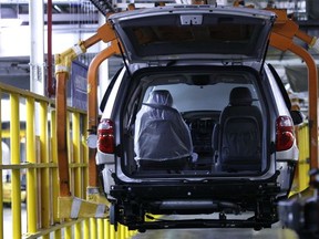 In this photo taken June 13, 2006, a minivan rolls on the production line at the Windsor Assembly Plant in Windsor.